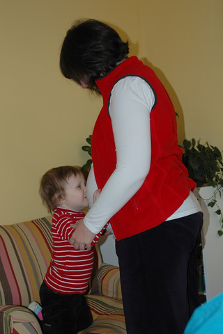 Donna kissing pregnant Mama