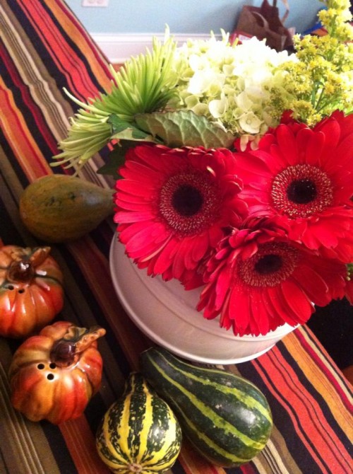 I could never cook a turkey people would want to eat, but then again, Mary Tyler Dad would never think to spray the table with mini gourds or arrange a vase of flowers.  Yin and yang, style and substance.  It works for us.