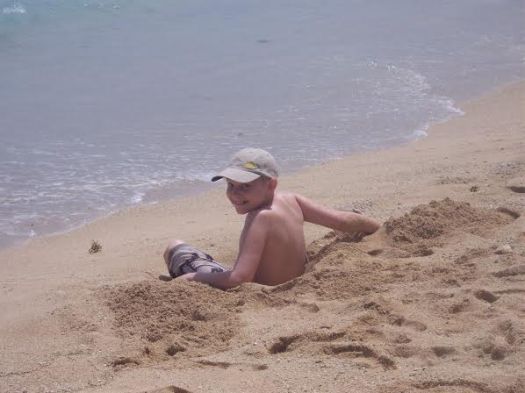 Matthew in his hat on that Hawaii beach.