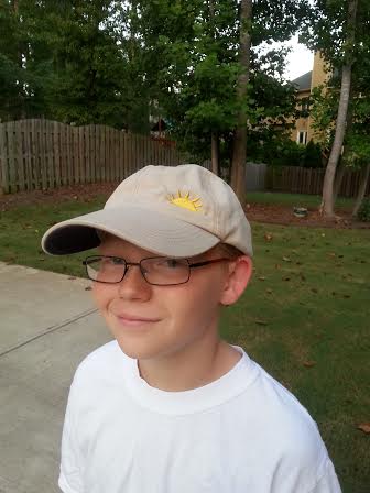Matthew's younger brother, Cameron, wearing the hat.  