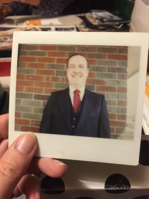 A Polaroid of my Dad looking dapper in his suit.  Early 1980s.