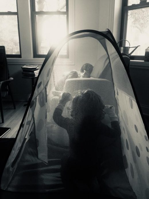 A boy, a tent, his puppets, and a brother. 